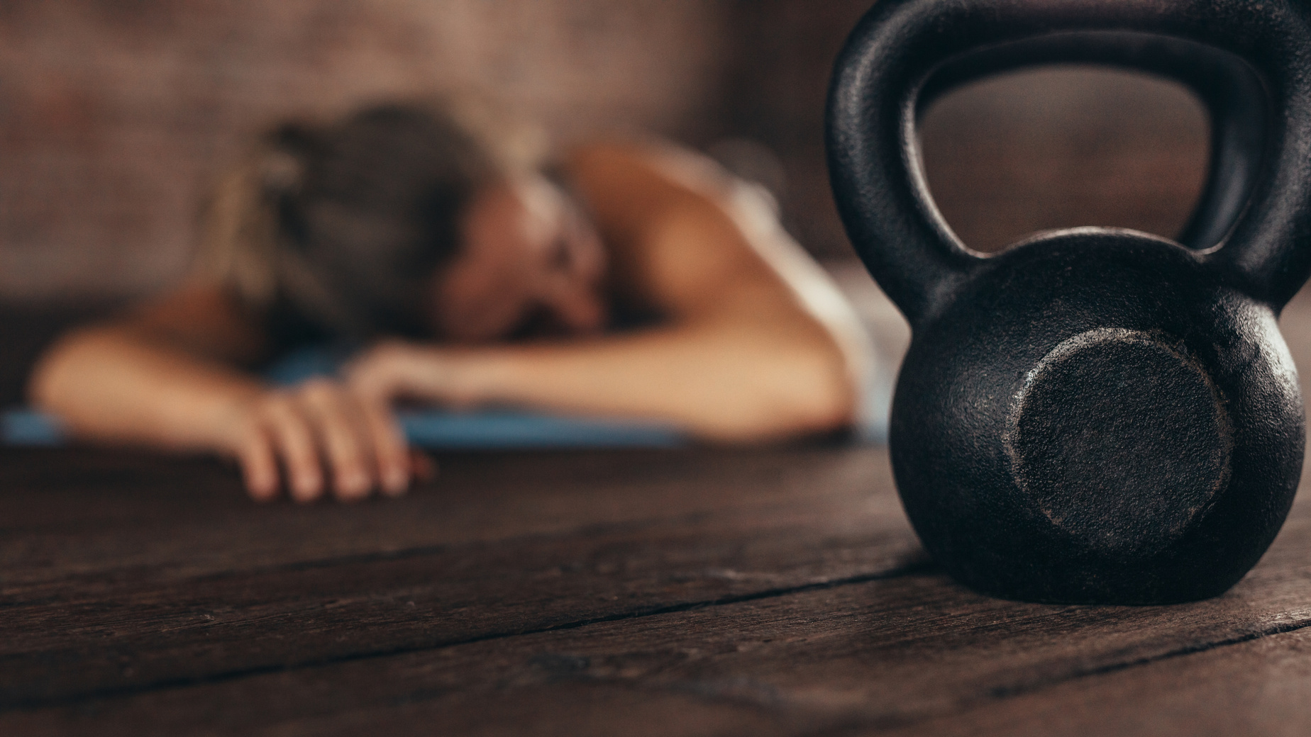 Cross Training Gym with Woman Resting after Workout