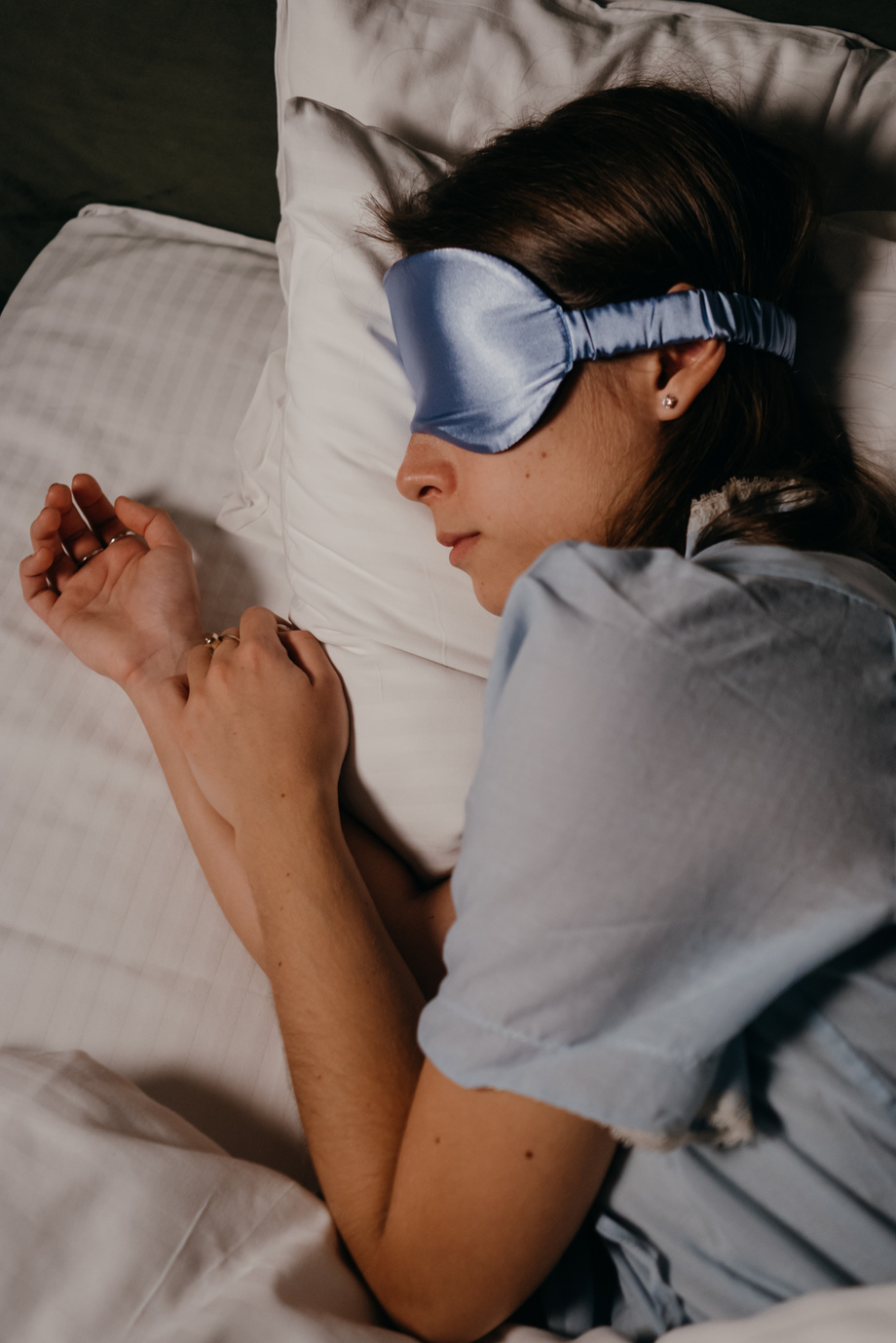 Asleep Woman wearing Eye Sleeping Mask